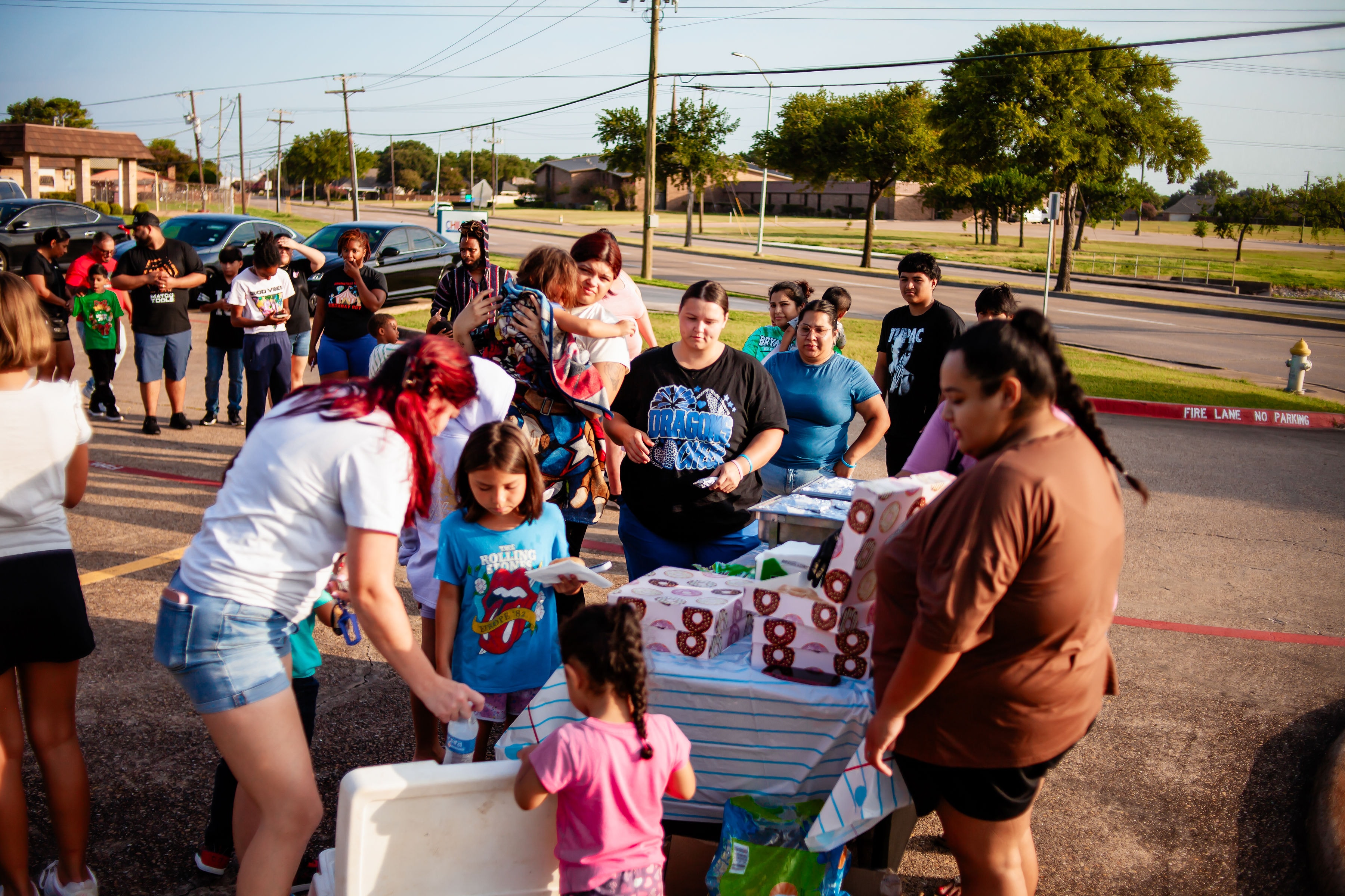 NexAir volunteers with families at the back-to-school event